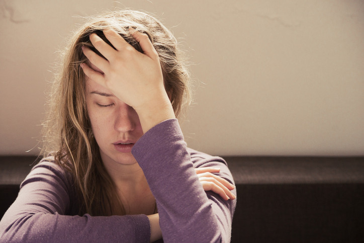 Person experiencing chronic fatigue, brain fog, and exhaustion
